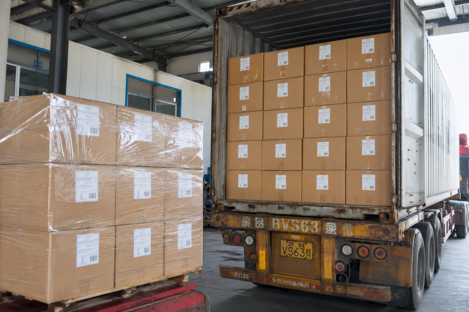 Container loading area with bulky lightweight packaging material cartons arranged for export shipment