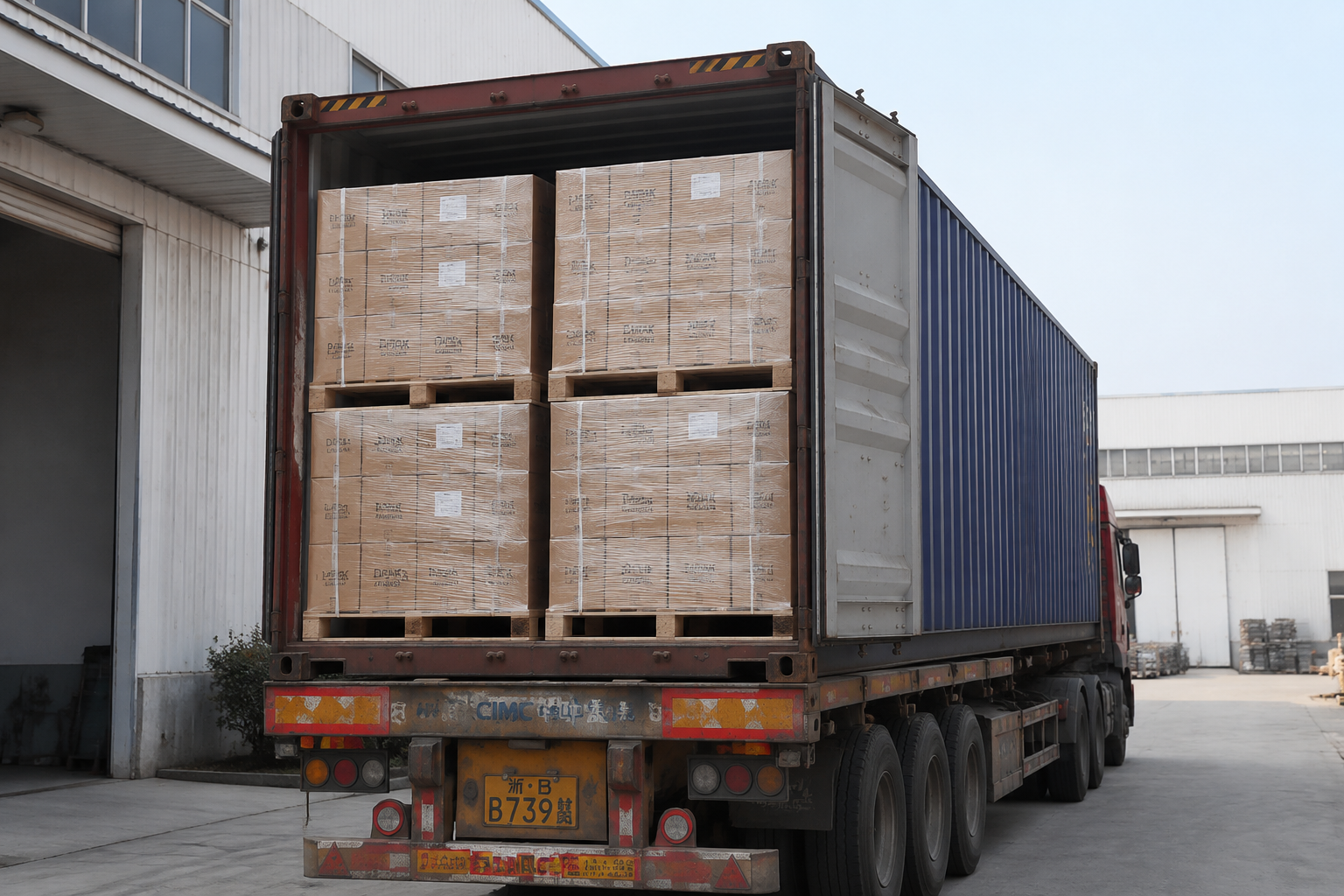 Container loading photo showing export cartons, pallet wrap, visible carton marks, and a sealed container before departure