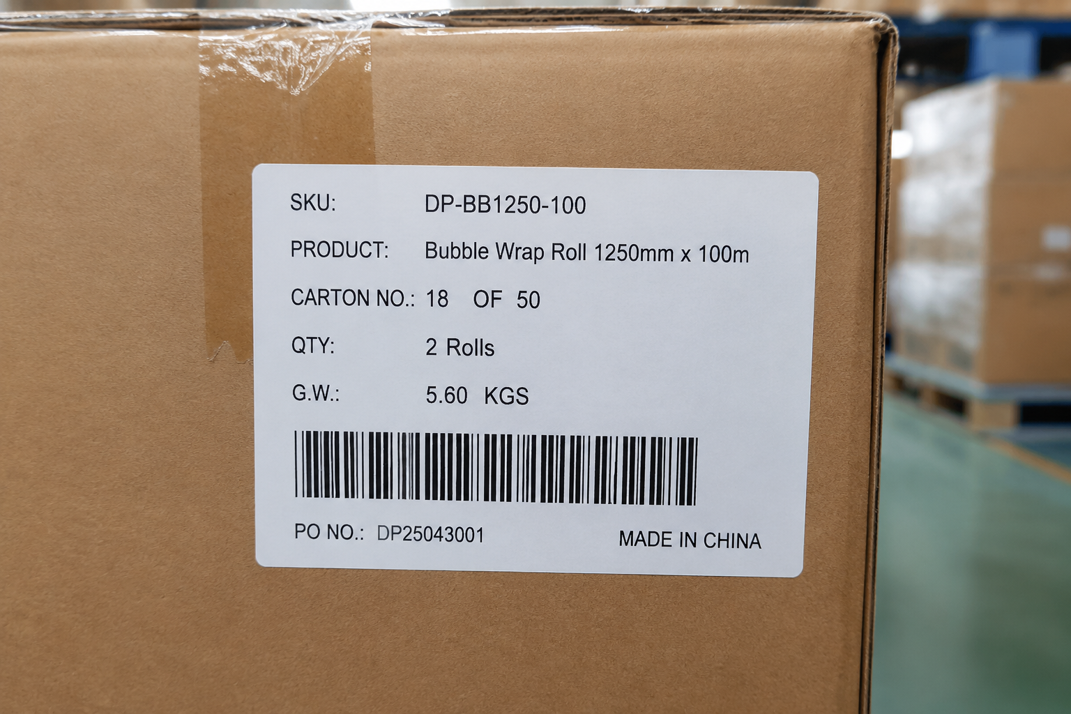 Close-up of carton label showing SKU code, product name, carton number, quantity, and gross weight for a packaging materials shipment
