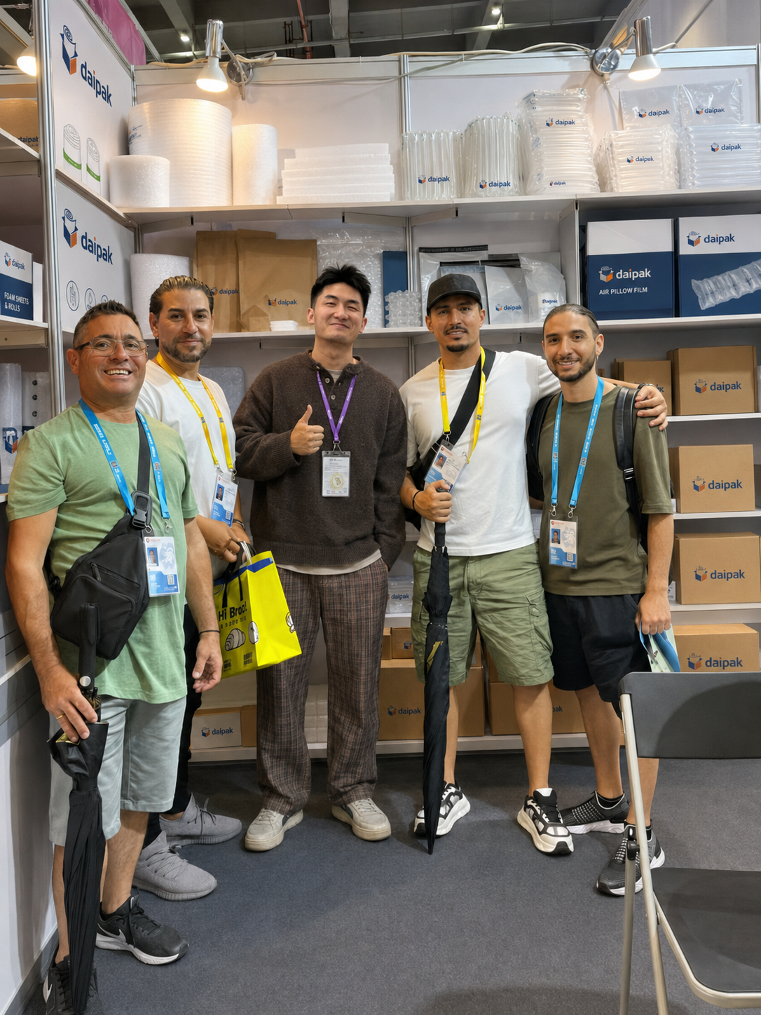 Daipak packaging exhibition booth with visitors and product samples